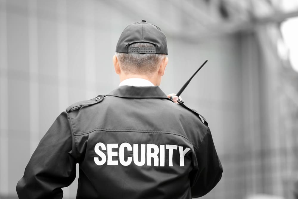 Professional unarmed security guard patrolling a commercial building in Northern California.